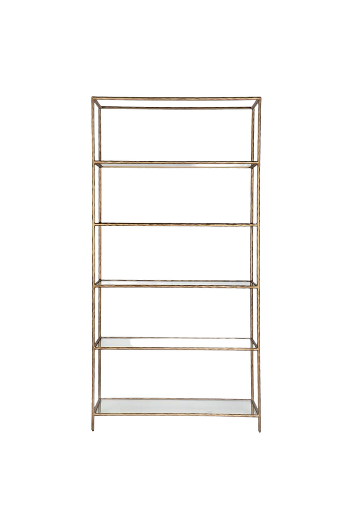 High rectangular book shelf with 5 glass shelves and a solid iron frame with antique brass finish and sharp edges on white background