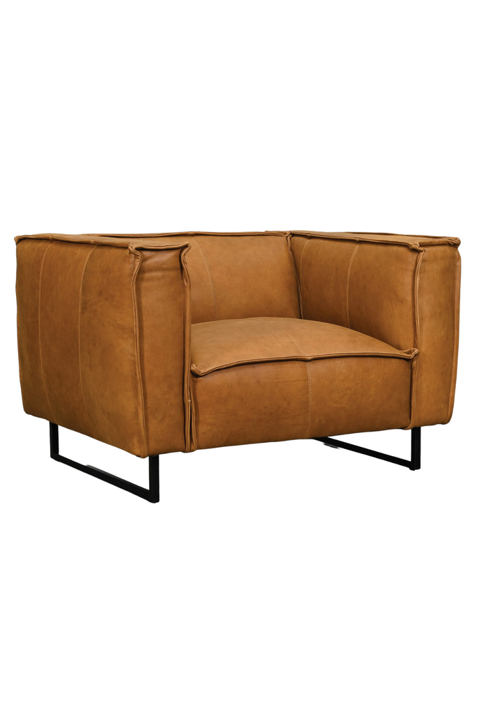 Cognac Leather arm chair with straight lines and stitched edge upholstery detailing on sleek black metal legs