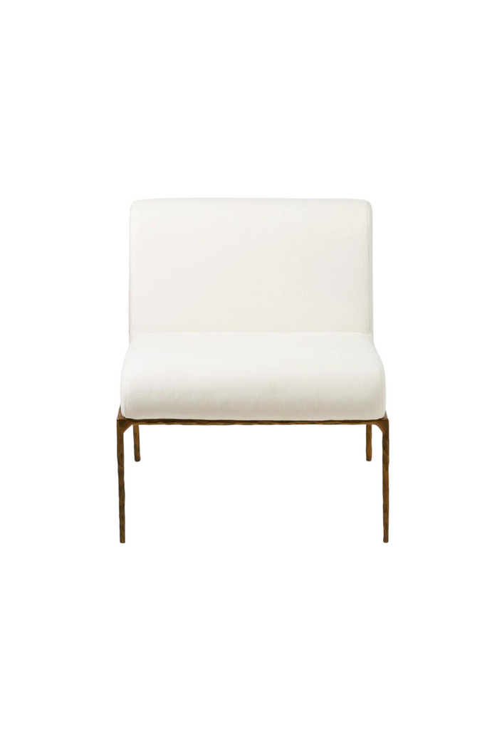 Armless occasional chair with hammered metal frame creating imperfect texture and an ivory upholstered seat cushion and back rest