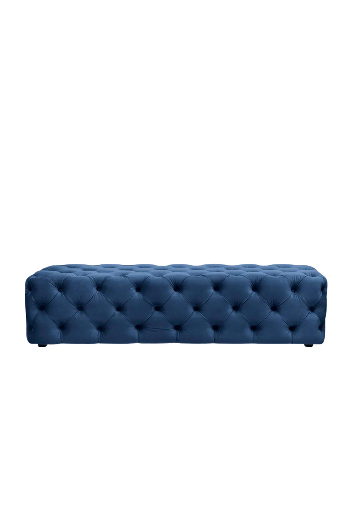 Solid Rectangular Bench Ottoman Fully Upholstered in Soft Navy Blue Velvet With Ample Button Tufting on White Background