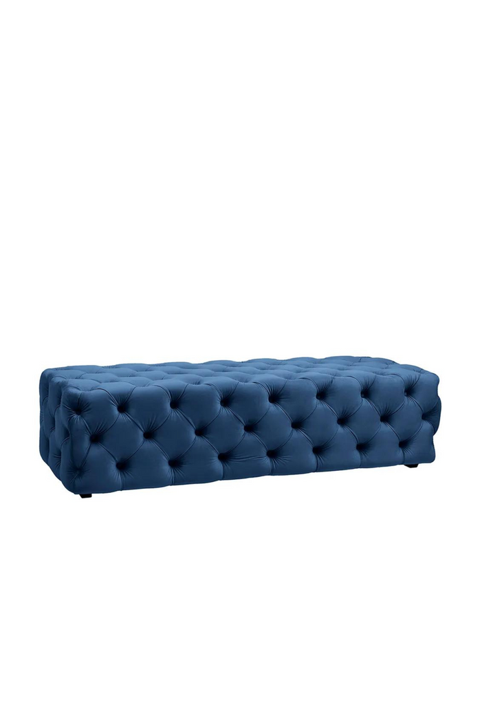 Solid Rectangular Bench Ottoman Fully Upholstered in Soft Navy Blue Velvet With Ample Button Tufting on White Background