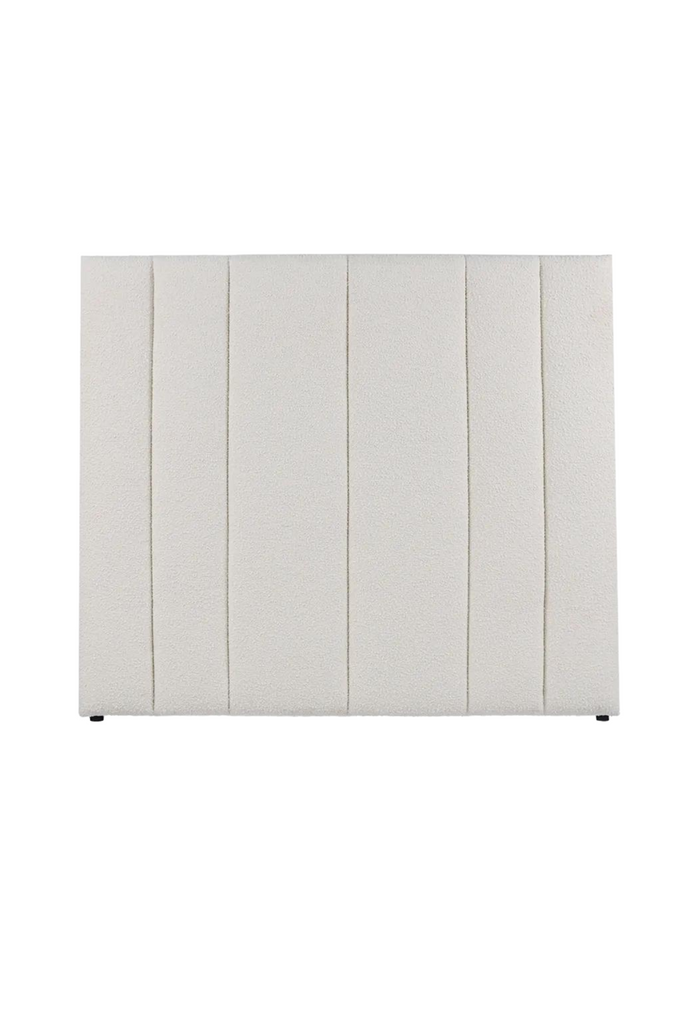 Luxurious free standing rectangular bedhead fully upholstered in white boucle with detailed panelling and vertical tufting