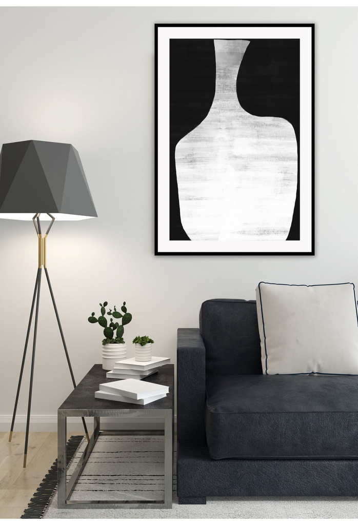 Minimal abstract modern portrait landscape print black round shapes framing grey textured spot in middle.