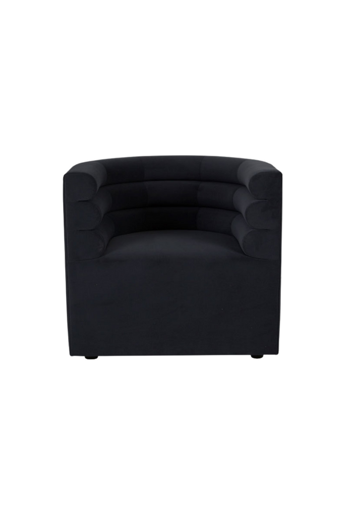 Stylish Curved Tub Style Arm Chair with a Rolled Back Fully Upholstered in Dark Blue Velvet on White Background