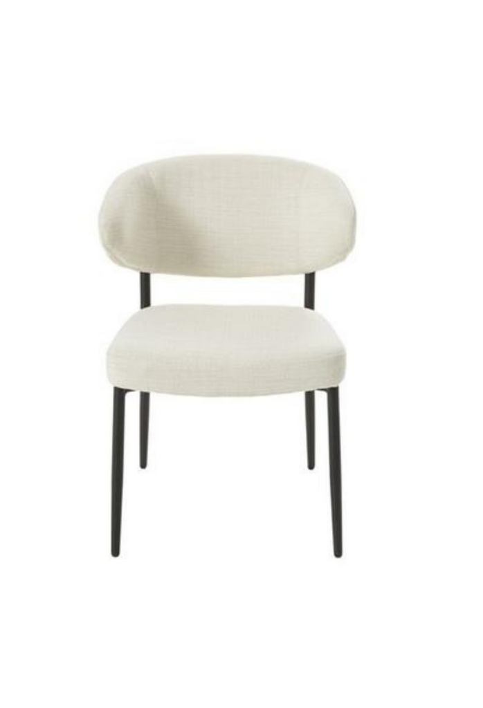Simplistic Dining Chair with Curved Cut Out Back Rest and Seat Upholstered in Cream Fabric and Sleek Black Metal Frame