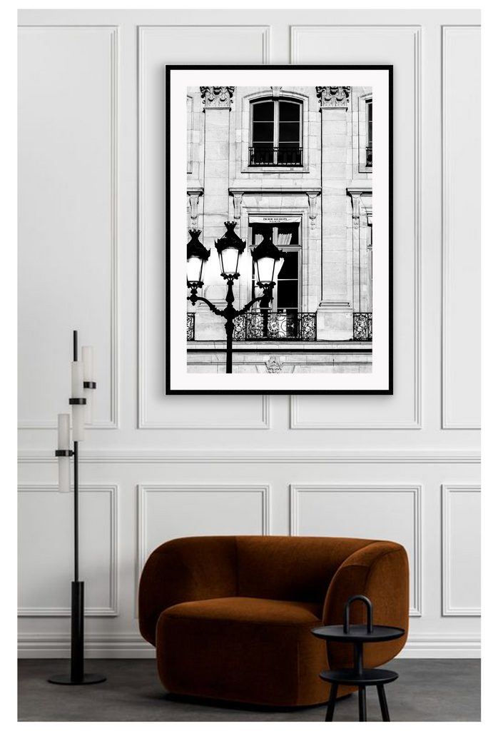 A black and white fashion photography print in paris with street lamp and architechture 