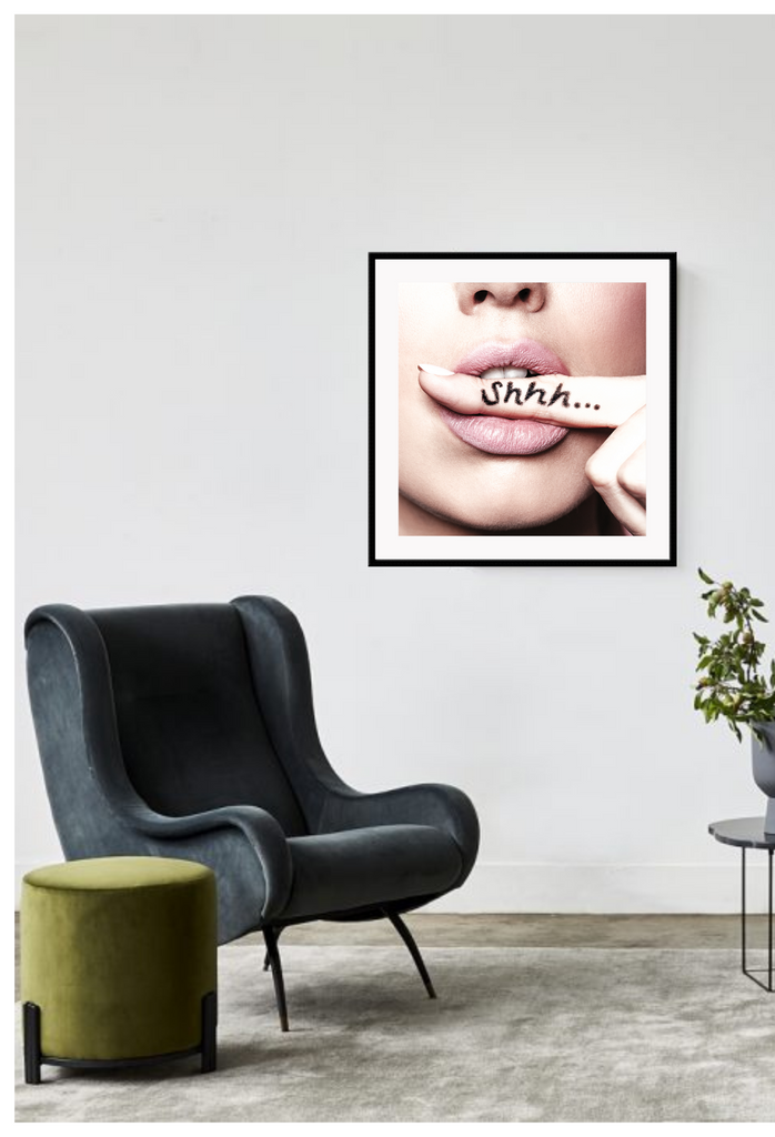 A fashion wall art with a sexy woman biting her finger saying shhh be quiet. 