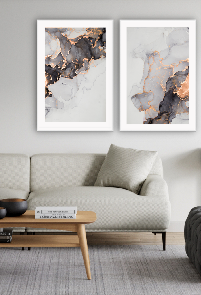 Modern art print featuring a marble-like texture in grey, black and white tones with a gold vein running through.