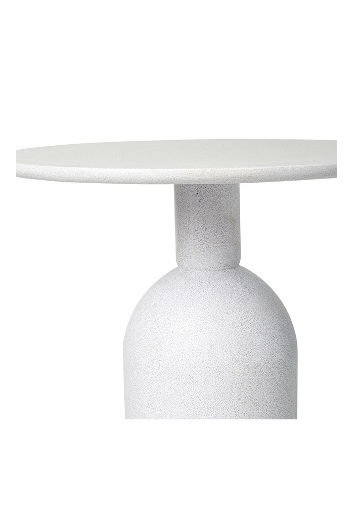 Small versatile side table with round table top and solid round pillar base in a white powder-stone finish