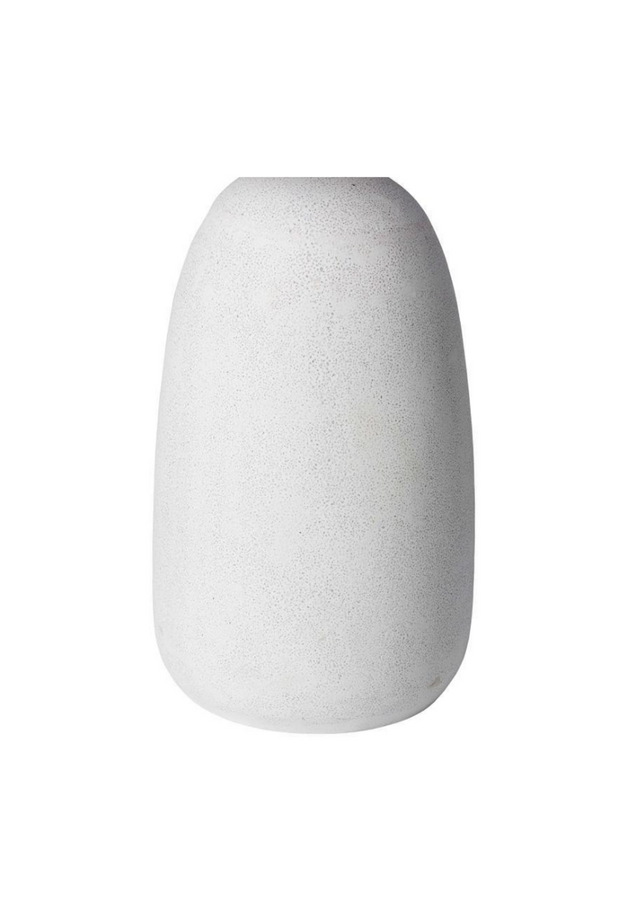 Small round outdoor table with a white stone finish and a solid round base on a white background