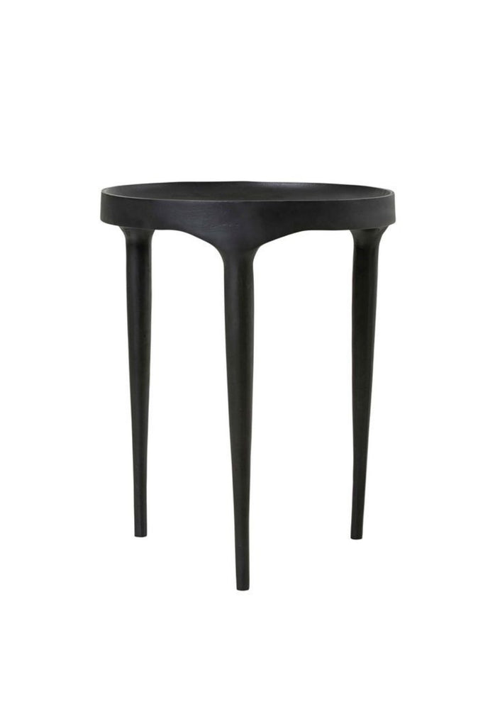Modern matt black metal coffee table with three long legs merging into a round concave table top on white background