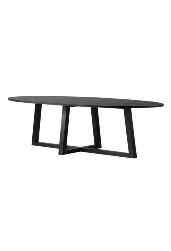 Large Black Oak Dining Table with four legs connecting to a crossed base and oval elliptical table top on white background