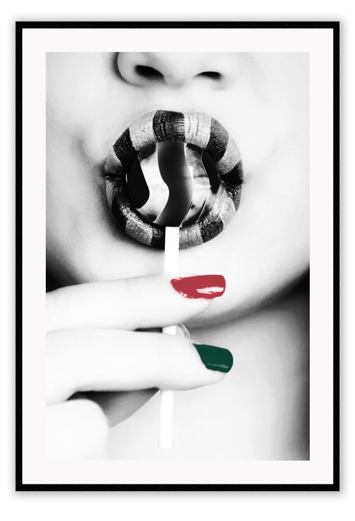 Black and white modern print featuring a woman sucking a lollypop with one green one red finger nail and striped lipstick.