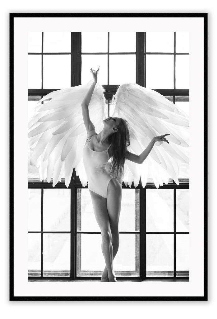 A fashion black and white wall art with the breath of the sun penetrating through big frosted window, back-liting an angel-like bellerina dancing with white feather wings and white leotards.  