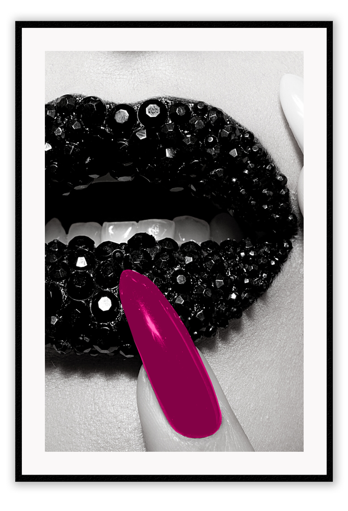 Fashion print of close-up diamond covered lips in black and white with a hot pink fingernail touching mouth