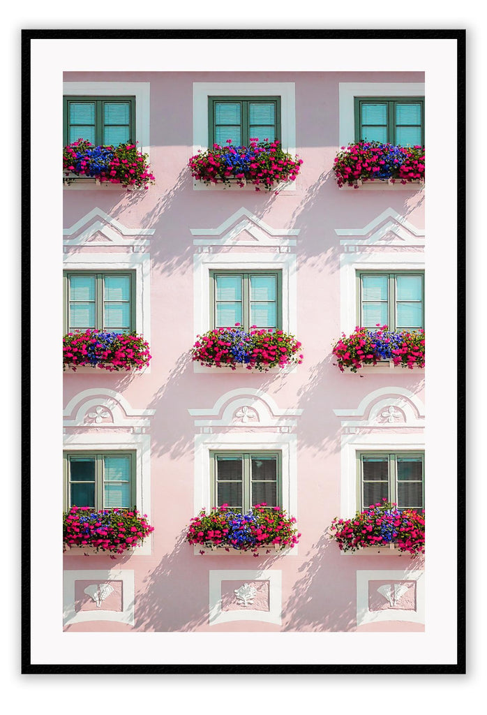 An italian architecture wall art with a pink classic European building facade and floral boutique on balconies. 