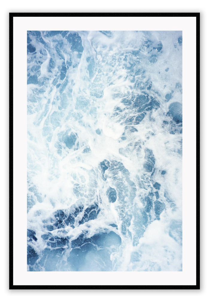Ocean print with a close-up of the blue sea and white wash. 