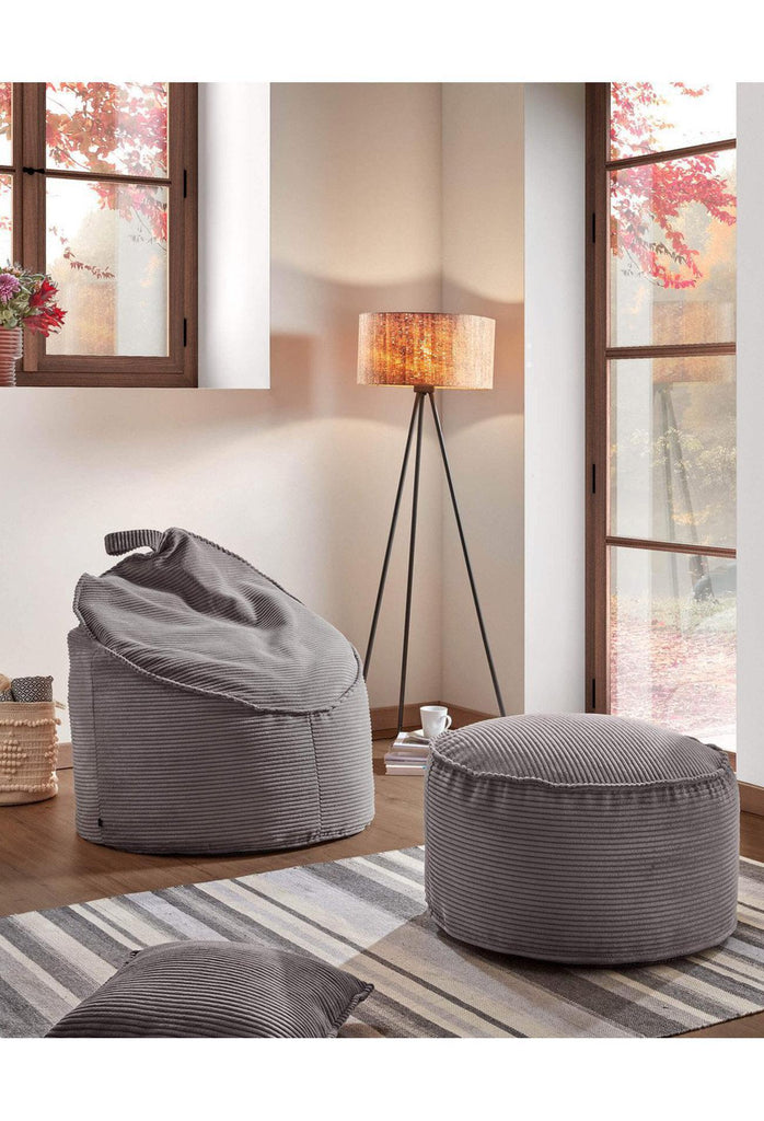 Modern Round Pouf with Soft Grey Corduroy Upholstery and Piping on a White Background