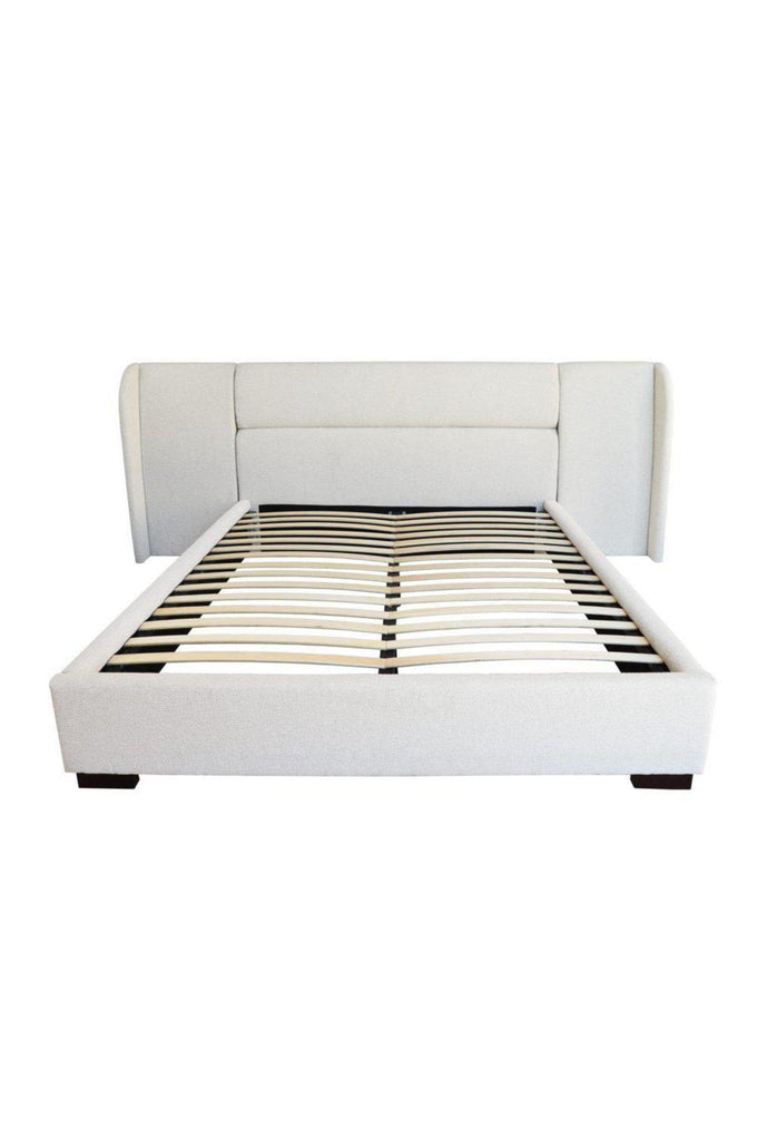 Modern Bed fully upholstered in textured pearl white fabric with a padded head board featuring generous wings extending out to the side
