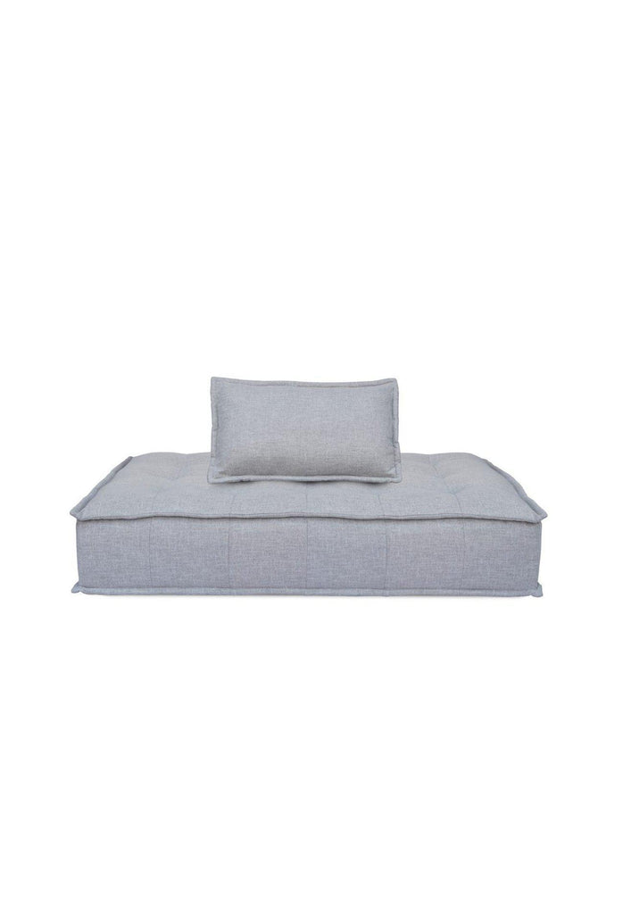 Rectangular Double lounger with button tufting fully upholstered in a textured grey fabric with matching cushion on a white background