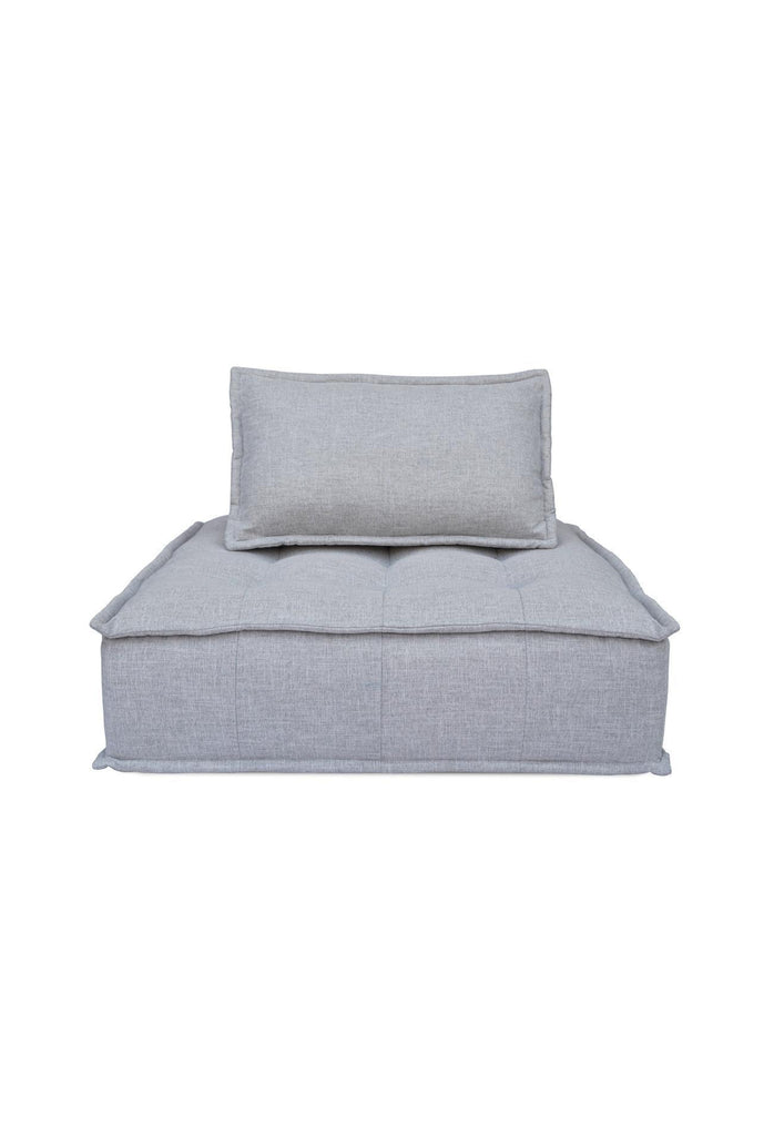 Square shaped lounger with button tufting fully upholstered in a textured grey fabric with matching cushion on a white background