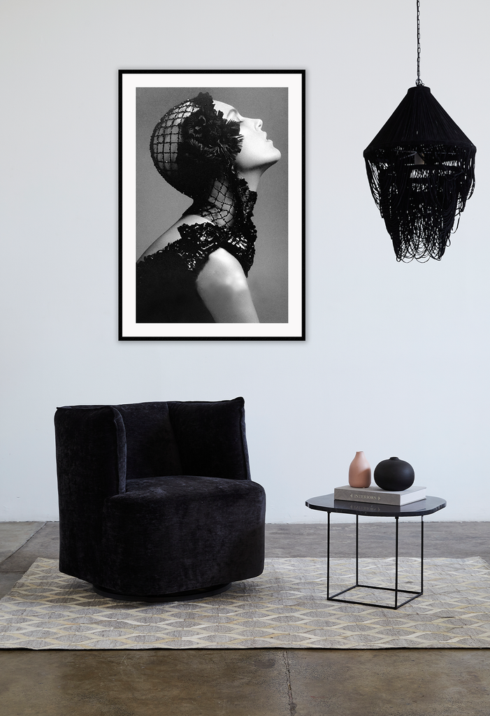 A black and white, vintage fashion wall art with Coco chanel woman wearing black lace flower. 