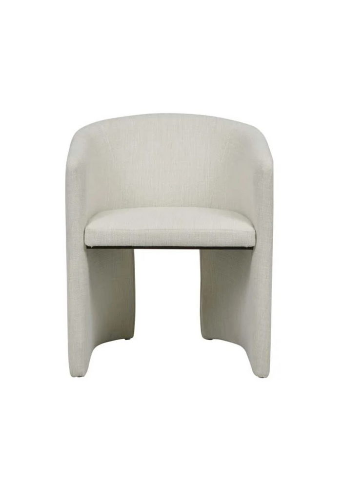 Petite armchair upholstered in fine natural white tweed with a curved back rest and a cut out base on a white background