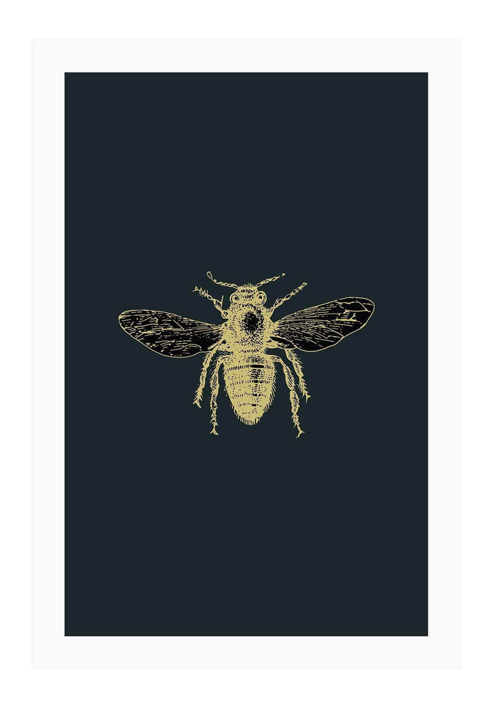 A natural wall art with brass bee on navy blue background that mimics an insect sample