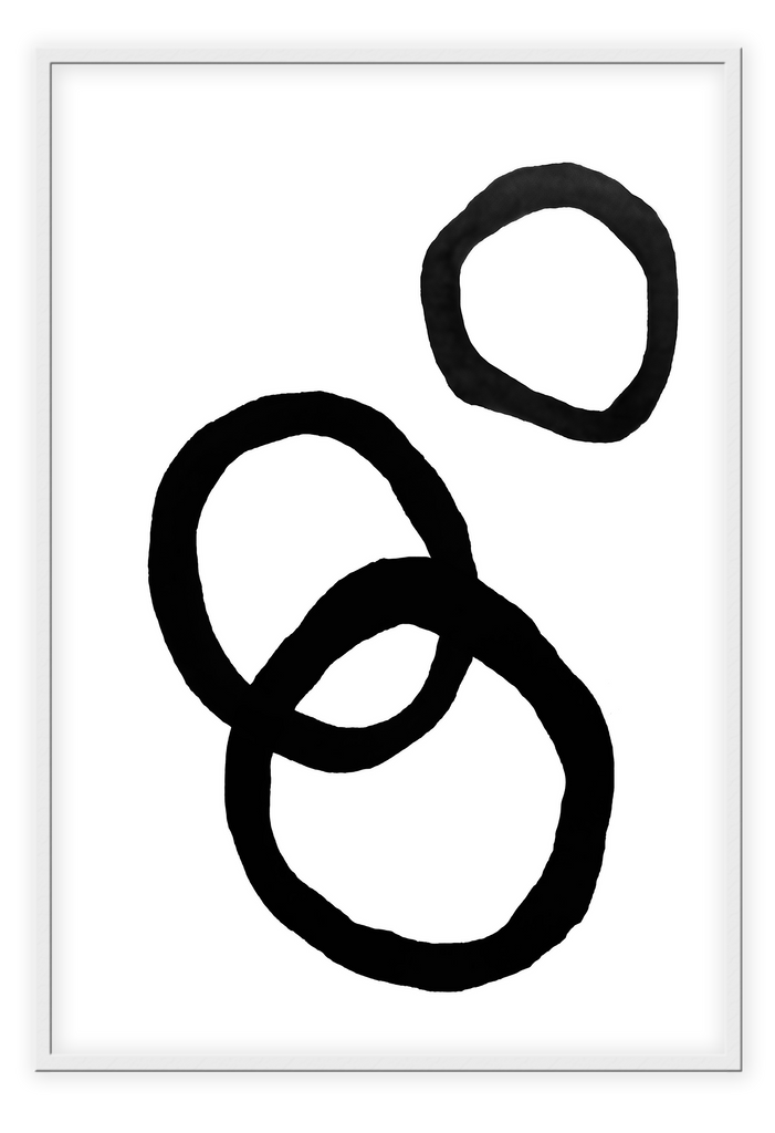 An abstract black and white wall art with black ink rings.