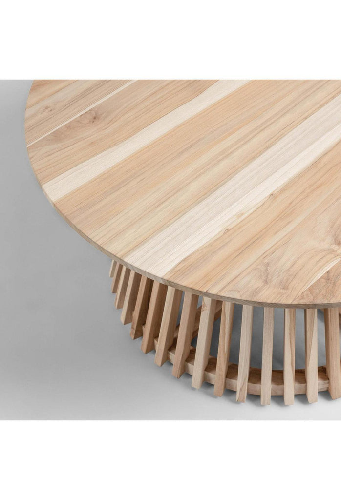 Round timber coffee table with a unique base created with natural coloured wooden panels placed one by one in a round shape on a white background