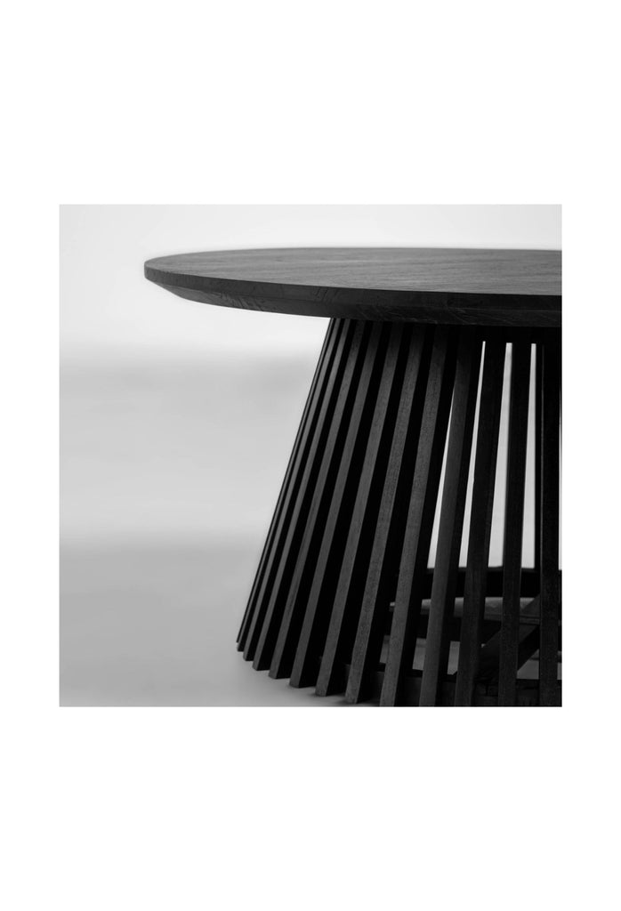 Black wooden round coffee table with a unique base created with black wooden panels placed one by one in a round shape on a white background