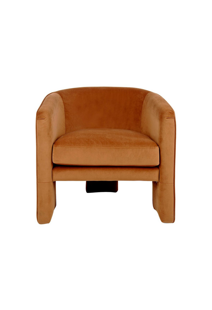 Caramel velvet armchair with round tub-style seat and 3 fully upholstered wide legs on a white background