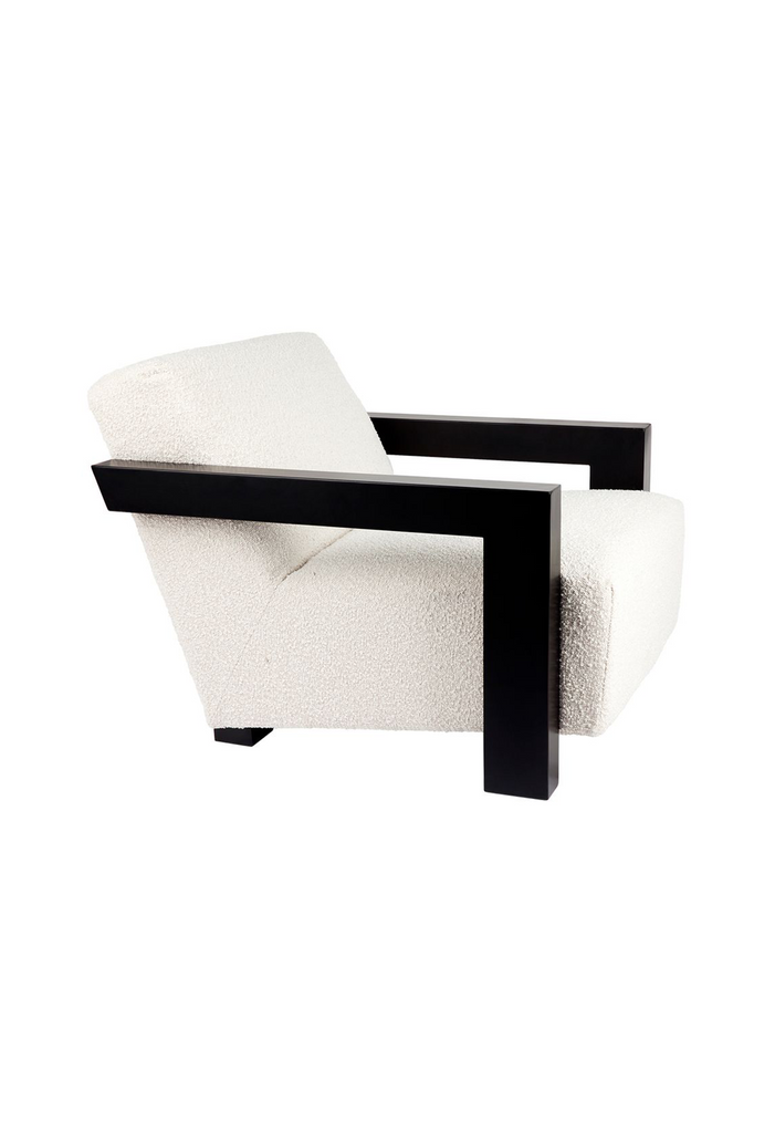 Modern Armchair upholstered in ivory boucle with black wooden arms in geometric shape and sharp edges on a white background