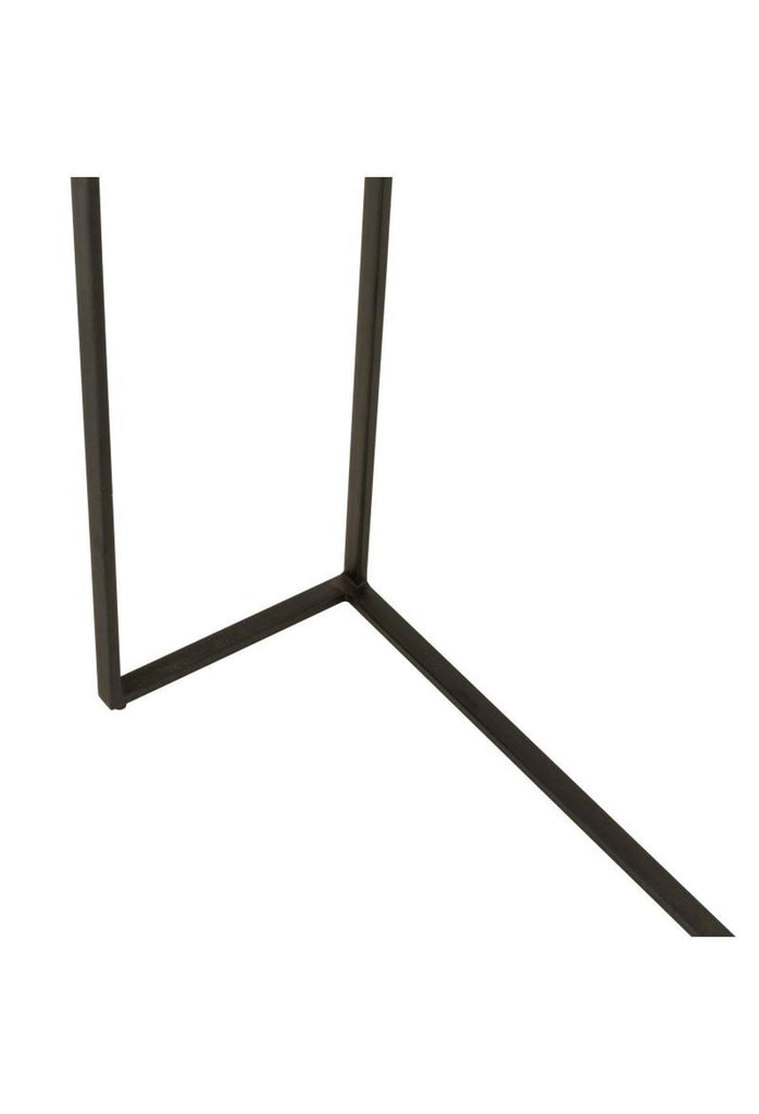 Petite black metal console table with half curved table top and sharp edges on the other side complemented by thin metal legs