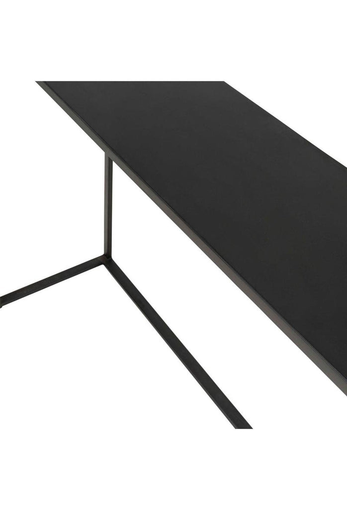 Petite black metal console table with half curved table top and sharp edges on the other side complemented by thin metal legs