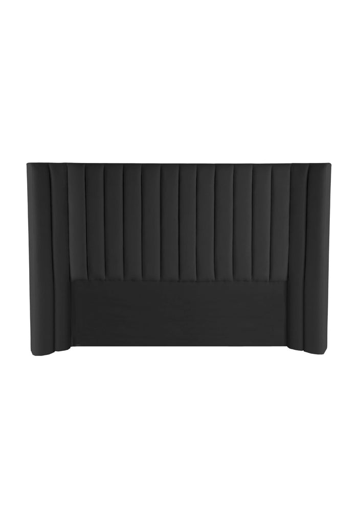 Plush Panelled Bedhead with Curved Sides Fully Upholstered in Black Velvet on a White Background