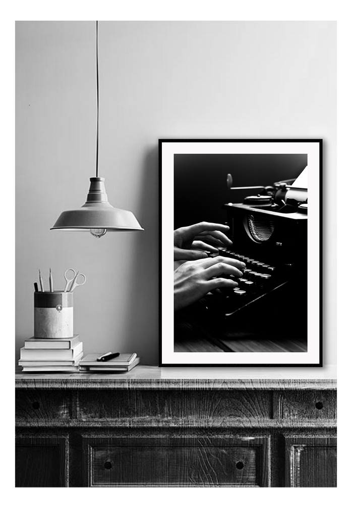 A vintage black and white wall art of a vintage type writer. 