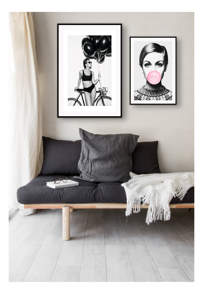 A fashion black and white wall art with a lady in lingerie holding balloons