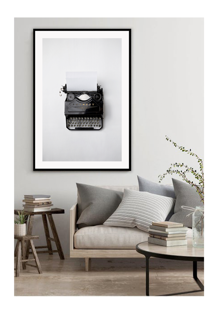 A vintage wall art with black and white type writer.