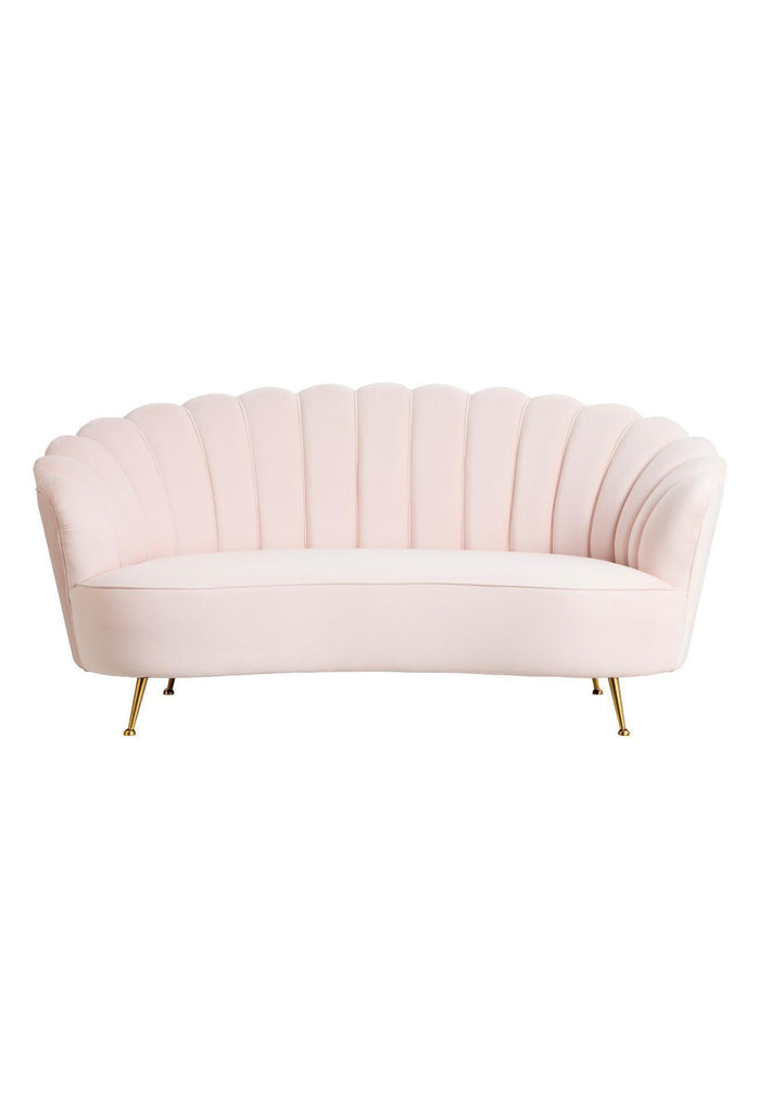 Curved Blush Velvet Sofa with Stitching and Piping Detailing Creating an Oyster Shaped Back Rest and four antique gold metal legs