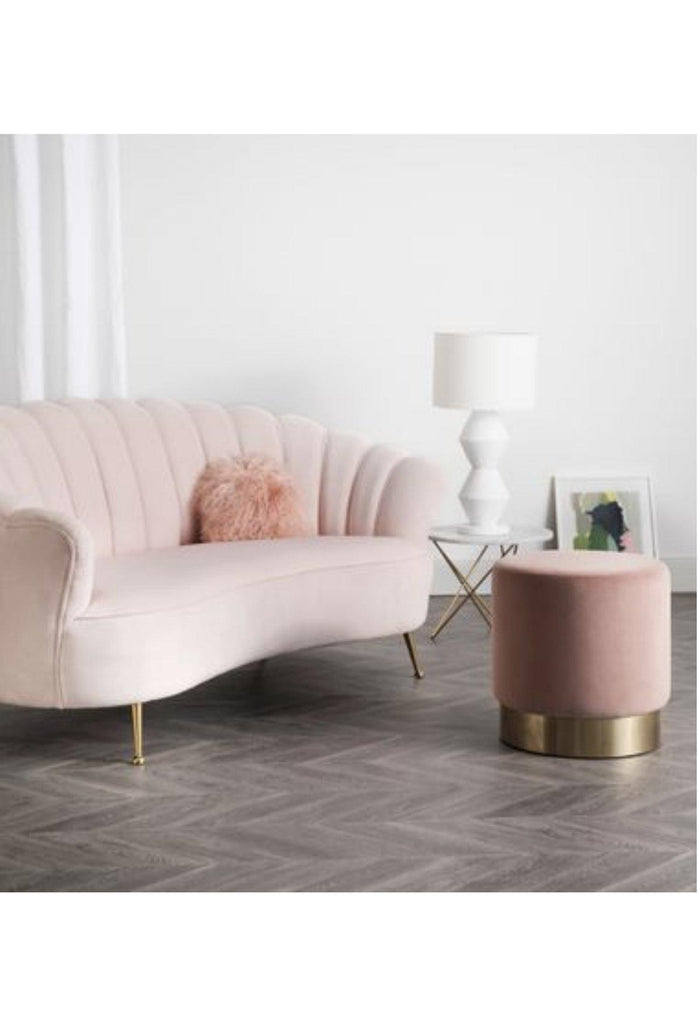 Curved Blush Velvet Sofa with Stitching and Piping Detailing Creating an Oyster Shaped Back Rest and four antique gold metal legs