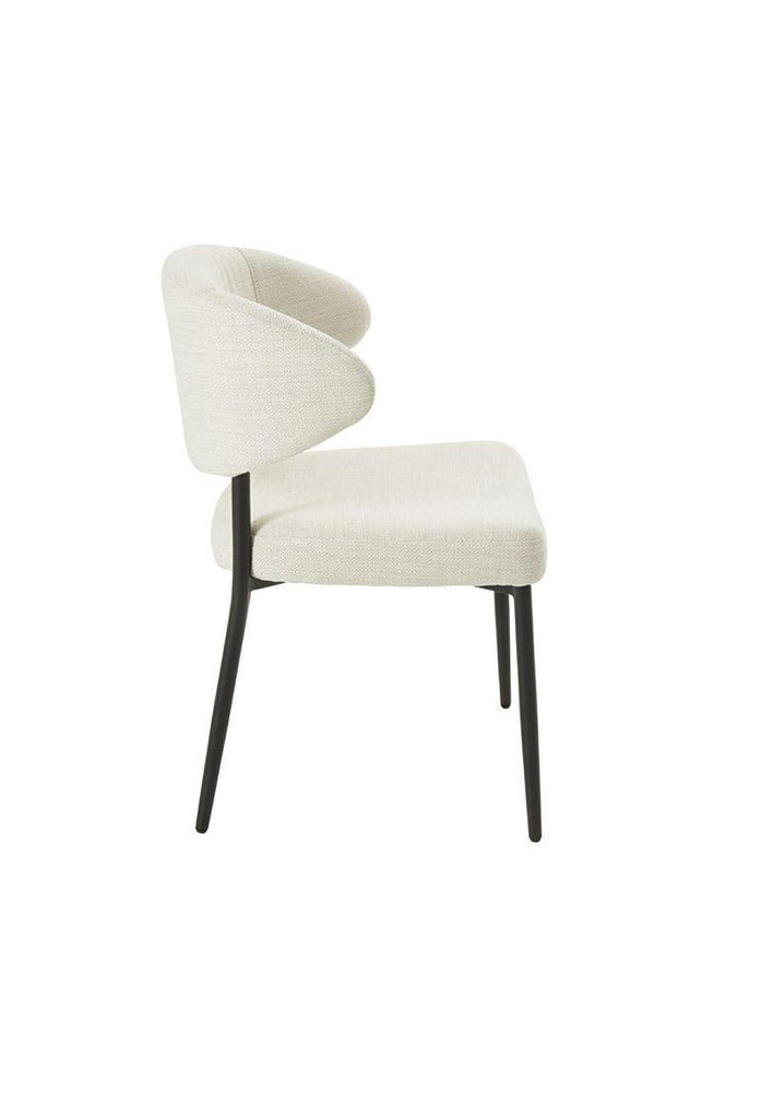 Simplistic Dining Chair with Curved Cut Out Back Rest and Seat Upholstered in Cream Fabric and Sleek Black Metal Frame