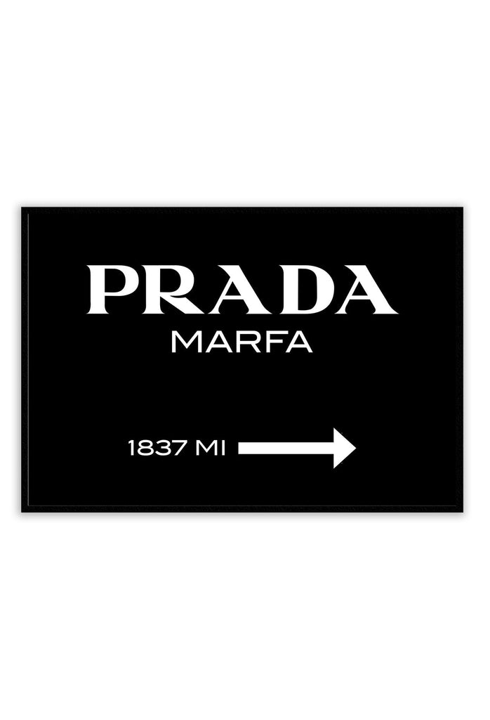A fashion typography wall art with white scandi prada marfa since 1837 writing on black background.  