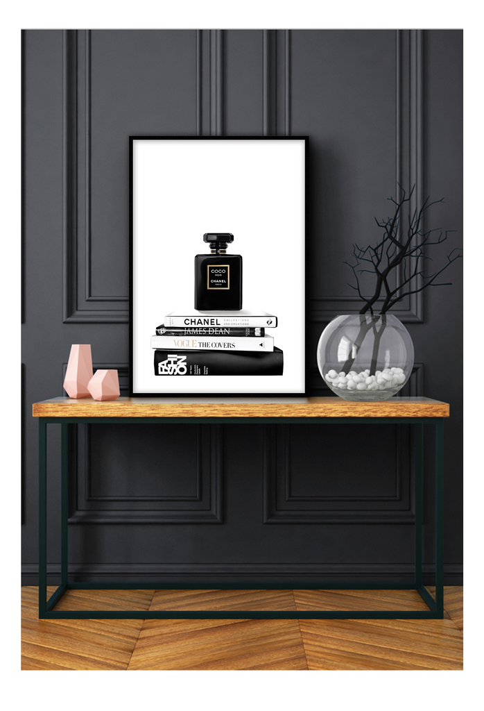 portrait print with black and white books and chanel perfume bottle on the top 