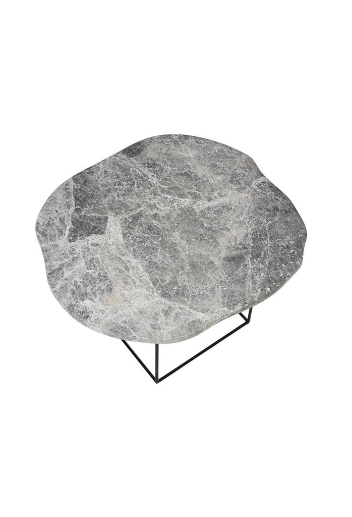 Side Table with grey and white marble top in organic round shape and a black metal frame on a white background