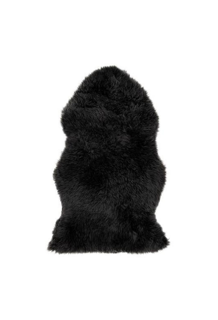 Natural Black Merino Sheepskin Featuring Long Silky Hair in its Organic Shape on White Background
