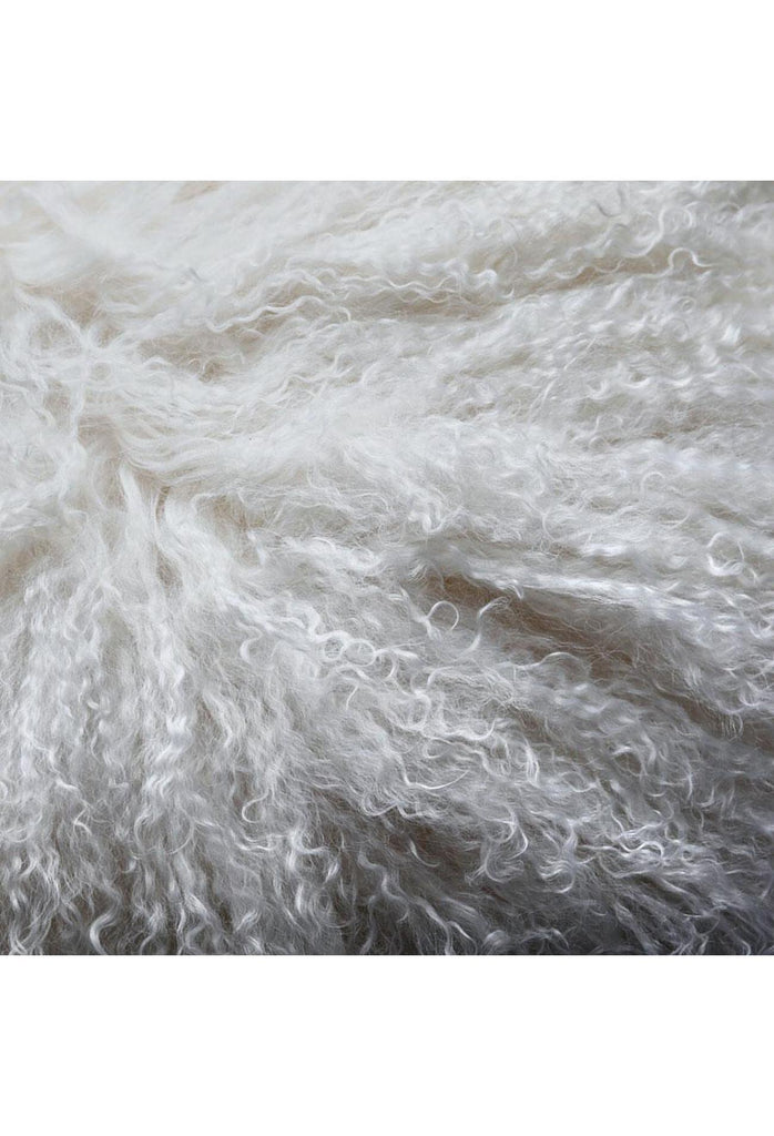 Mongolian Sheepskin in its natural shape and in a natural white colour on white background