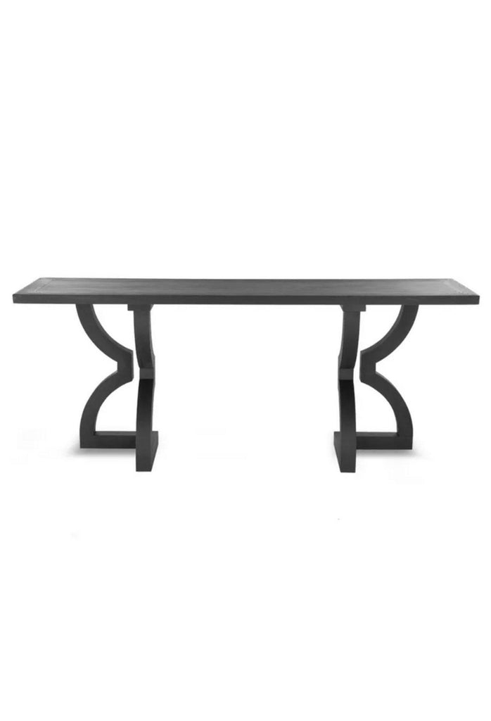 Black oak console table with solid rectangular table top and chunky curvy shaped legs with sharp edges on the base