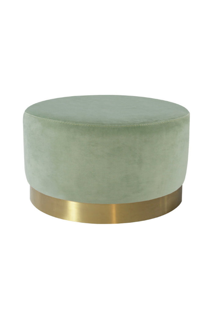 Large round ottoman fully upholstered in a light sage coloured velvet with a brushed gold base on a white background