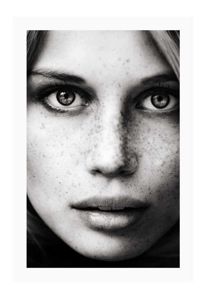 Close up photography print black and white freckles mondel with light eyes and striking features 